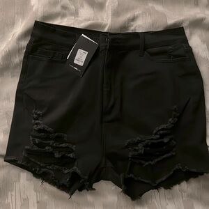 Brand New all black distressed shorts.